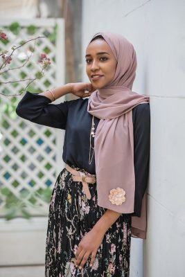 hijabi model iN EMMA Scarf Dazzle in Mauve staring at a distance