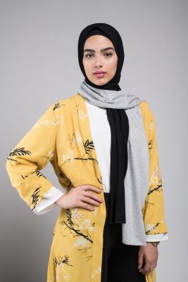 hijabi model in EMMA scarf midnight sugar with her hand on her waist staring at camera