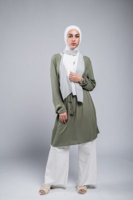 full body shot of hijabi Model in EMMA Scarf Silver Sugar staring at camera with her hand on her chest