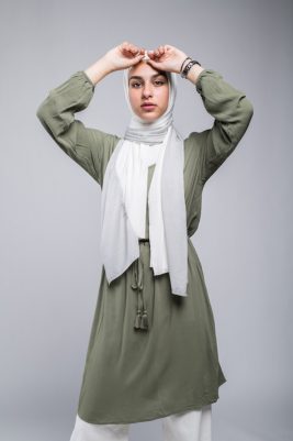 hijabi model in EMMA Scarf Silver sugar staring at camera with her hand on her forehead