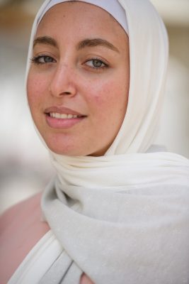 close up of beautiful hijabi girl in EMMA scarf Silver sugar looking at camera