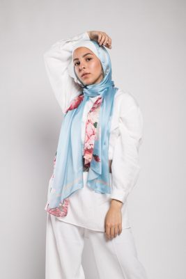 Hijabi Model in EMMA Scarf Aqua Fleuri staring at camera with her hand on her head