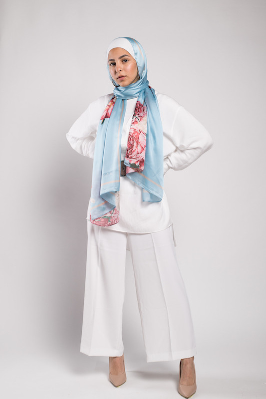 full body shot of hijabi model in EMMA Scarf Aqua Fleuri staring at camera with her hand on her back