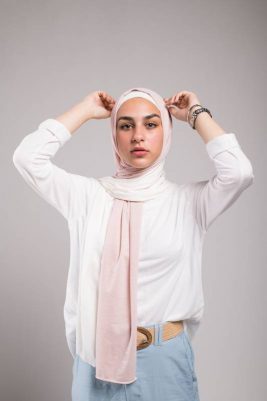 hijabi model in EMMA Scarf Pink sugar with her hand on top of her head