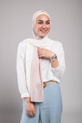 hijabi model in EMMA Scarf Pink sugar laughing in a white top, studio shoot