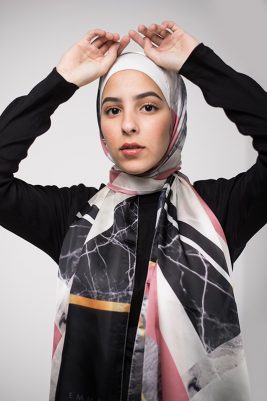 Hijabi model in EMMA Scarf Retro Classic with her hand in the air