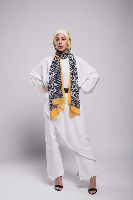 EMMA Scarf Aztec Sunshine on a hijabi model with her hands on her waist