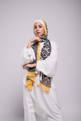 Hijabi Model in EMMA Scarf Aztec sunshine with her hand under her chin