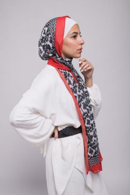 Hijabi model in EMMA Scarf with Aztec Patterns and a red border