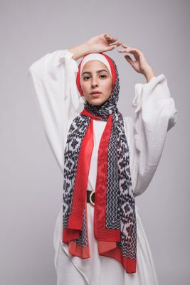 hijabi model in EMMA scarf Aztec rouge with hands in the air