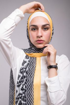 Close up of hijabi in an EMMA Scarf Aztec sunshine with yellow border