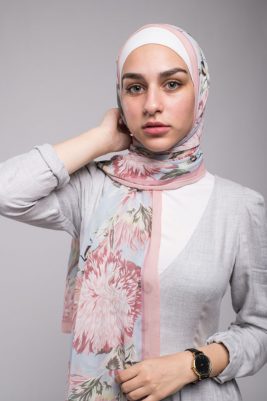 close up of hijab model with green eyes staring at camera in EMMA Scarf Honey Blooms Chiffon