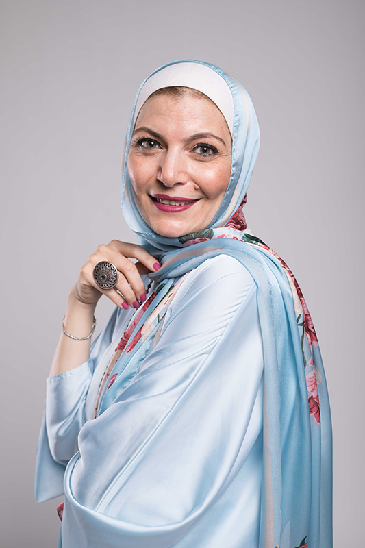 A close up f a hijabi woman in EMMA Aqua Fleuri