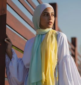 hijabi model in EMMA scarf Kiwi Zest looking at a distance
