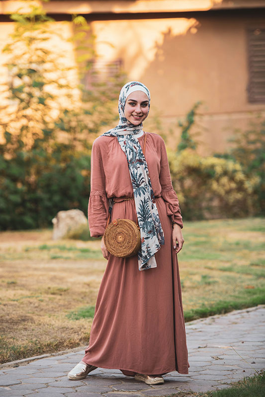 Beautiful hijabi looking at camera and smiling in EMMA Scarf Camel Denim