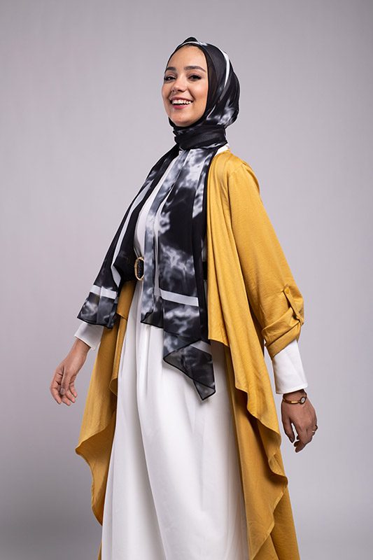 Hijabi Model wearing EMMA Scarf Black Marble turns around at the camera