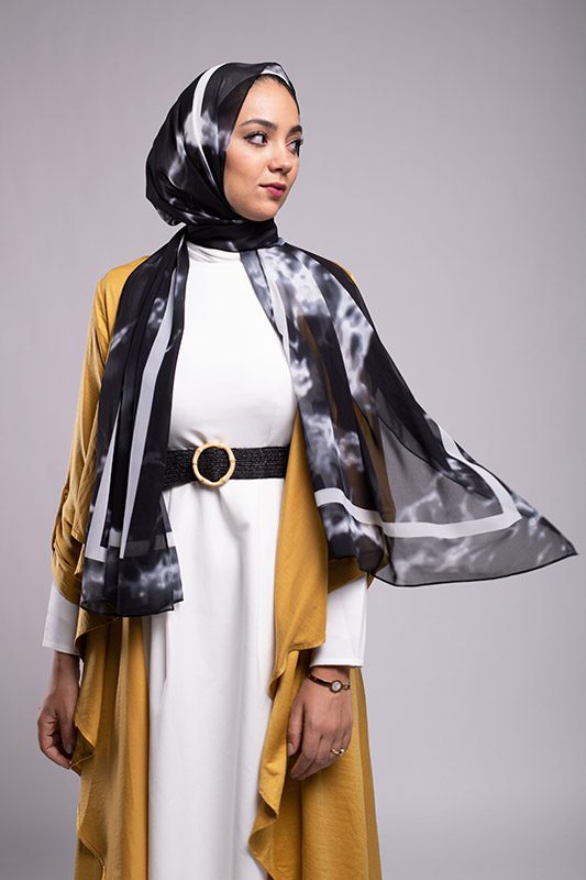 Hijabi Model wearing EMMA Scarf Black Marble with the hijab flowing