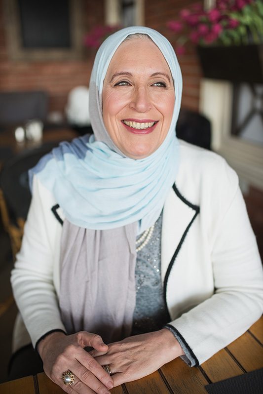 Old white hijabi woman wearing EMMA scarf Soul Surfer
