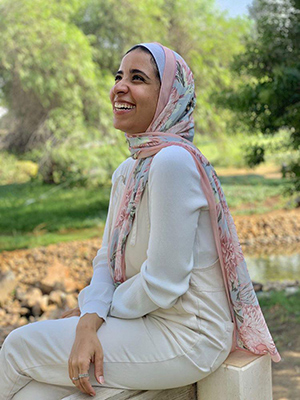 EMMA customer laughing in her EMMA hijab Honey Blooms Chiffon