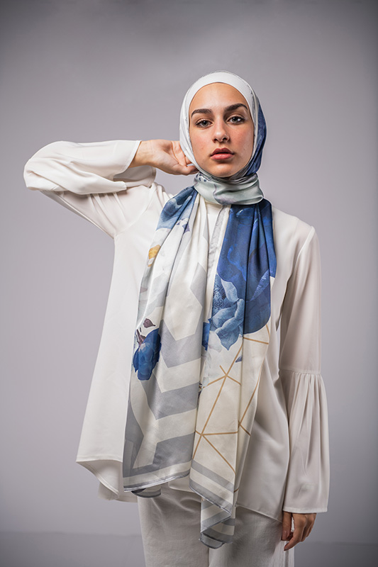 Hijabi Model in EMMA Satin Hijab Pareisienne Azure, with gold geometric lines,Roses in hues of blue and grey lines