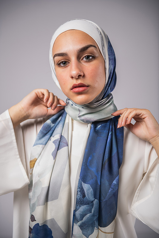 Hijabi Model in EMMA satin scarf Pareisienne Azure, with hues of blue, grey and gold