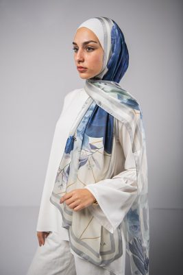 Hijabi Model in EMMA Satin Hijab Parisienne Azure, with gold geometric lines,Roses in hues of blue and grey liines