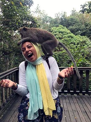 EMMA customer wearing her Kiwi Zest hijab with a monkey on her shoulder