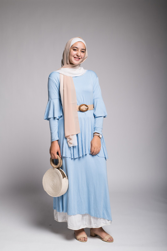 Hijabi Model in EMMA Scarf Salted Caramel smiling at camera in blue frill dress