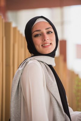 hijabi model in EMMA Scarf Midnight sugar smiling at camera