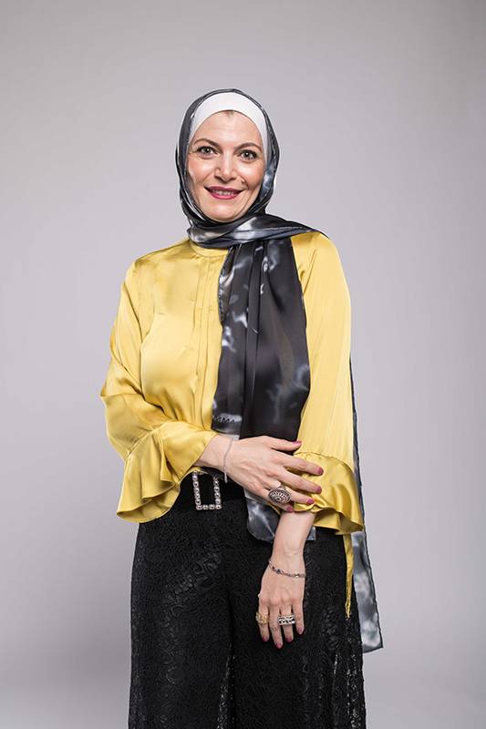 Hijabi styling her EMMA scarf Black Marble Satin in a yellow blouse with frill sleeves