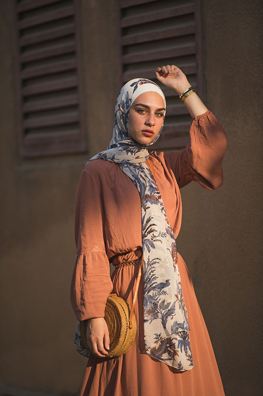 hijabi model looking at camera in her EMMA Scarf Camel Denim