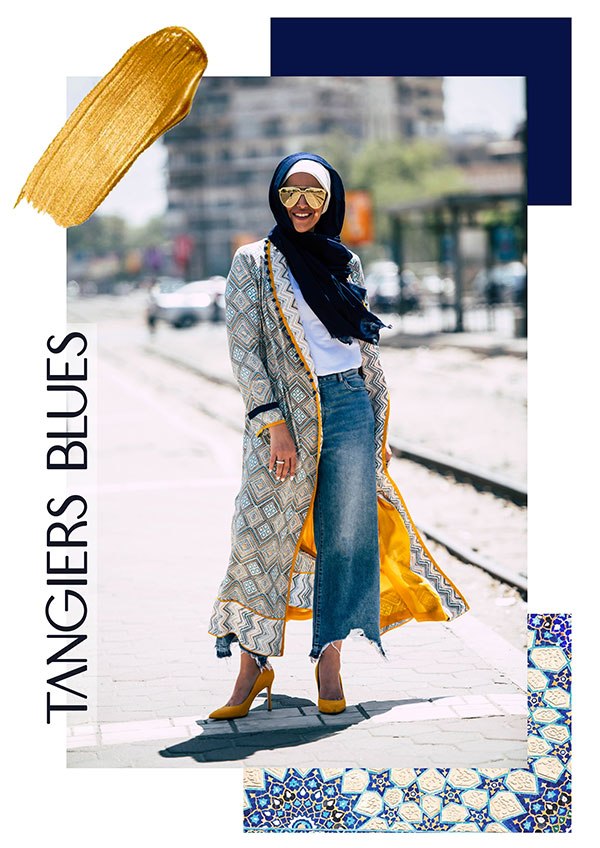 Hijabi Woman in EMMA Scarf Basic Navy , jeans a colorful kimono and yellow heels looking at camera