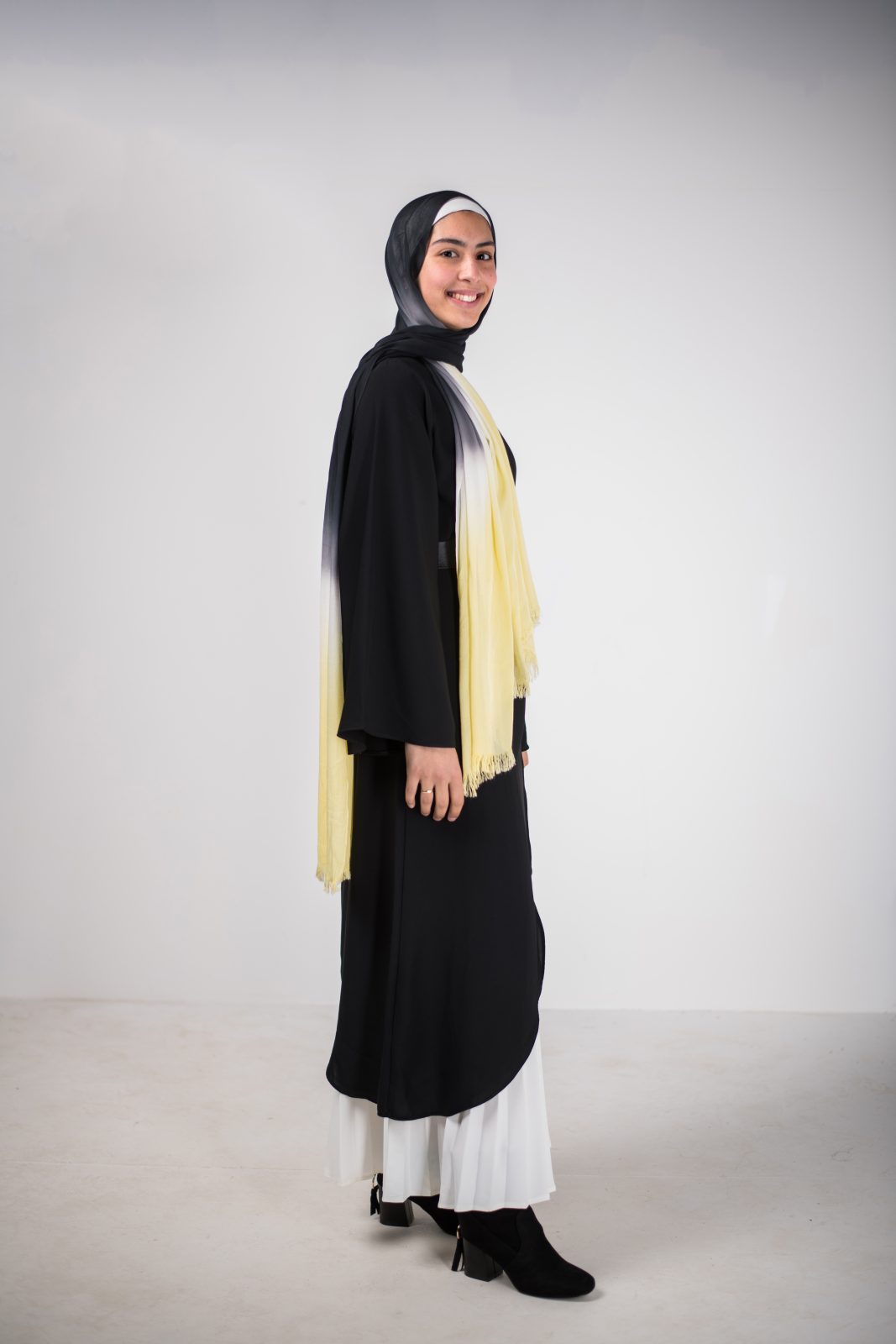 hijabi model in EMMA Scarf Electric Black smiling at camera