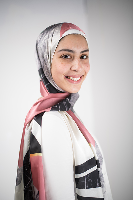 close up of hijabi model in EMMA Scarf Retro Classic and a white blouse