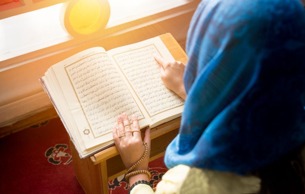 Woman reading Quraan